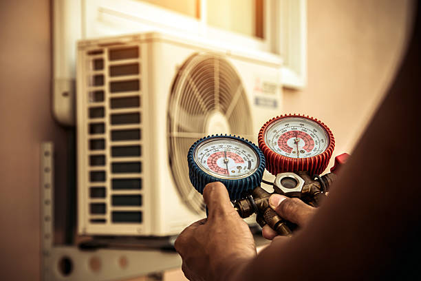 Professional Heat Pump Repair technician working in Spring Valley, NY